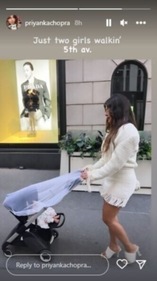 In the photo, Priyanka looked fondly at Malti as she pushed the stroller.
