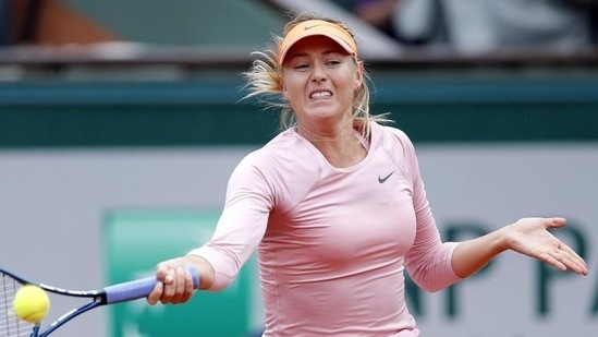 Maria Sharapova of Russia serves to compatriot Ksenia Pervak during their first round match for the French Open tennis tournament at Roland Garros in Paris (EPA Photo)