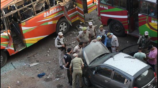 Police inspect the site of one of the explosions. (PTI) Police inspect the site of one of the explosions. (PTI)