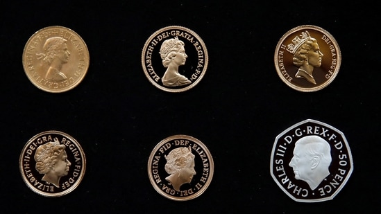 The official coin effigy of Britain’s King Charles III is seen on a 50 pence coin alongside five definitive coinage portraits of the late Queen Elizabeth, in London.(REUTERS)