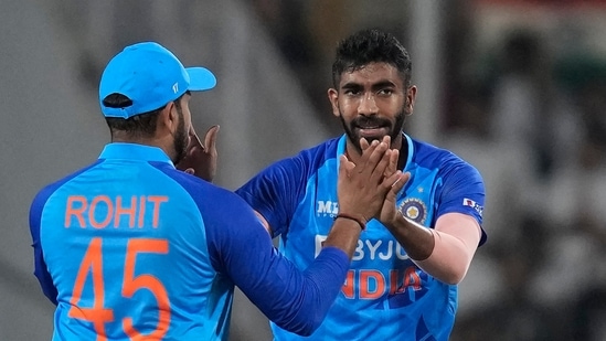 India's Jasprit Bumrah, right, celebrates with captain Rohit Sharma&nbsp;(AP)