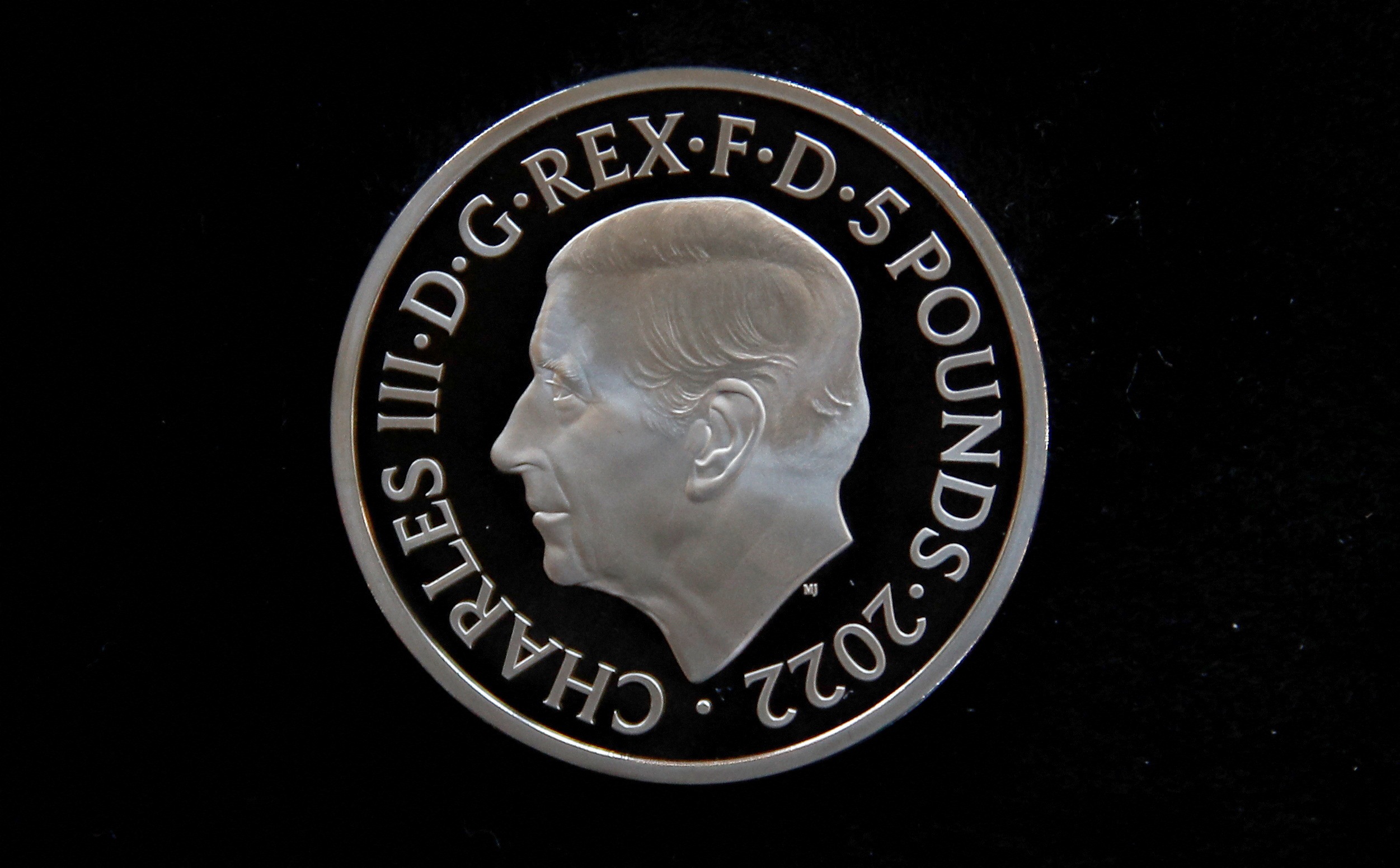 The official coin effigy of Britain’s King Charles III is seen on a £5 crown, unveiled by The Royal Mint. (REUTERS)
