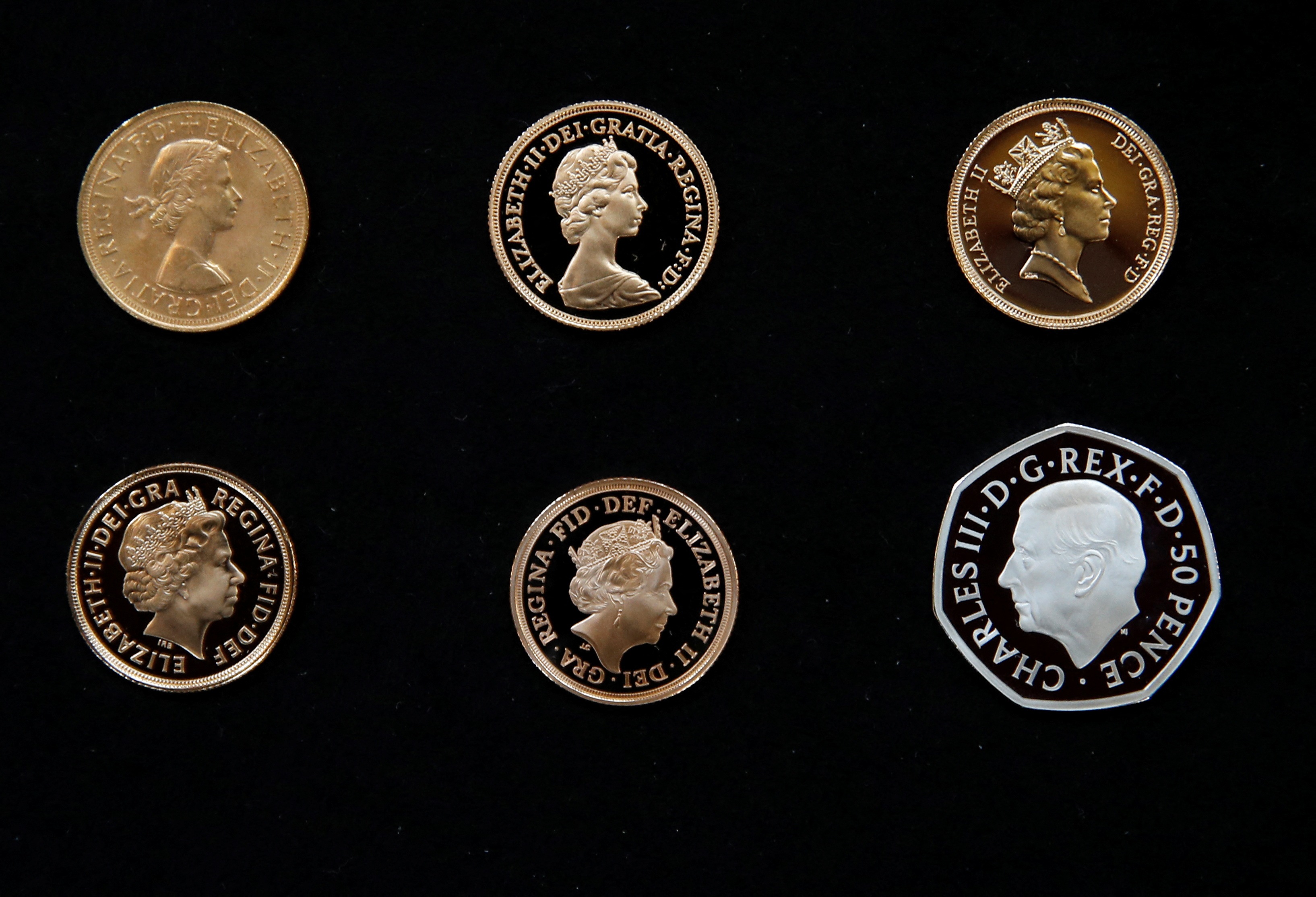 The official coin effigy of Britain’s King Charles III is seen on a 50 pence coin alongside five definitive coinage portraits of the late Queen Elizabeth, in London. (REUTERS)