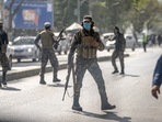 Taliban fighters stand guard at the explosion site, near a mosque, in Kabul, Afghanistan, September 23. Taliban fighters stand guard at the explosion site, near a mosque, in Kabul, Afghanistan, September 23. 