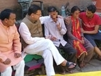 Uttarakhand CM Pushkar Singh Dhami meets parents and relatives of 19-year-old resort receptionist at their residence in Dobh Srikot village in Pauri district.