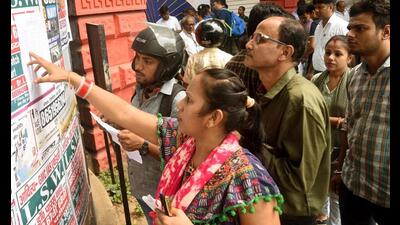 BPSC exam aspirants search for their roll numbers at a exam centre n Patna on Friday. (Santosh Kumar/HT Photo) BPSC exam aspirants search for their roll numbers at a exam centre n Patna on Friday. (Santosh Kumar/HT Photo)