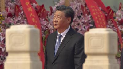 Chinese President Xi Jinping walks past floral bouquets during a ceremony to mark Martyr's Day at the Monument to the People's Heroes at Tiananmen Square in Beijing, on Friday. (AP) Chinese President Xi Jinping walks past floral bouquets during a ceremony to mark Martyr's Day at the Monument to the People's Heroes at Tiananmen Square in Beijing, on Friday. (AP)