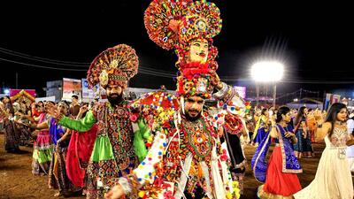 People perform 'garba' during Navratri celebrations in Bhopal on Thursday. (PTI) People perform 'garba' during Navratri celebrations in Bhopal on Thursday. (PTI)