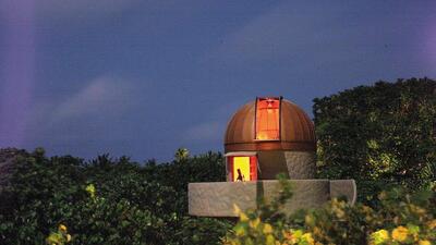 The astronomy tower at Soneva Fushi, which has a 16-inch telescope that rises from the ground