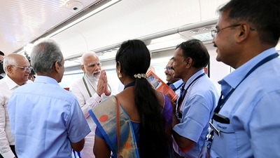 Prime Minister Narendra Modi interacting with people while taking a ride in Vande Bharat Express. (ANI) Prime Minister Narendra Modi interacting with people while taking a ride in Vande Bharat Express. (ANI)