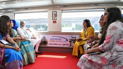 Prime Minister Narendra Modi interacts with co-passengers during a ride in the Vande Bharat Express. (ANI/ PIB) Prime Minister Narendra Modi interacts with co-passengers during a ride in the Vande Bharat Express. (ANI/ PIB)