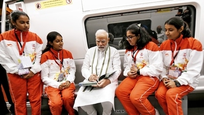 Prime Minister Narendra Modi interacts with a group of girls during his ride in Vande Bharat Express at Gandhinagar station on Friday. (ANI/ PIB) Prime Minister Narendra Modi interacts with a group of girls during his ride in Vande Bharat Express at Gandhinagar station on Friday. (ANI/ PIB)