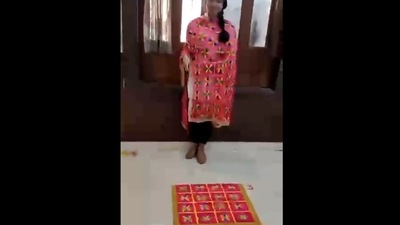 The image, taken from the viral video on Twitter, shows a woman standing next to a rangoli designed like her dupatta. (Twitter/@hvgoenka) The image, taken from the viral video on Twitter, shows a woman standing next to a rangoli designed like her dupatta. (Twitter/@hvgoenka)