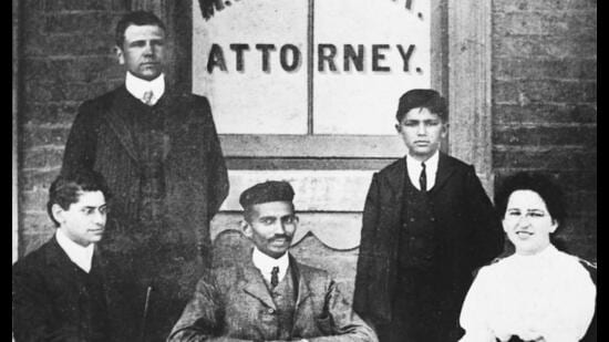 Gandhi (centre) with co-workers at his Johannesburg law office, six years after the Durban incident. (Courtesy National Gandhi Museum)