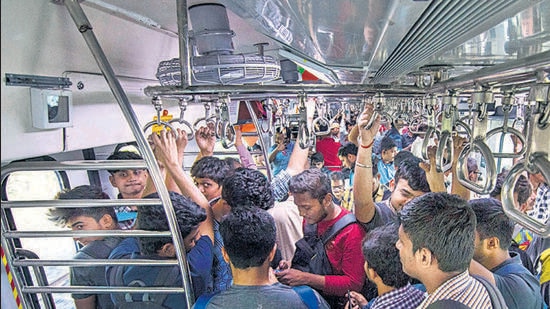 Mumbai, India - January 30, 2020: People travel from Central Railways first Air conditioned EMU local train which goes from Panvel to Thane in Mumbai, India, on Thursday, January 30, 2020. (Photo by Pratik Chorge/Hindustan Times) (Pratik Chorge/HT Photo)