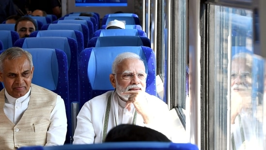Prime Minister Narendra Modi with Gujarat governor Acharya Devvrat in the Vande Bharat Express.(ANI)