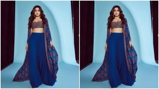 Styled by fashion stylist Gaurviv Desai, Rashmika wore her tresses open in soft wavy curls with a middle part. In statement golden earrings, she further accessorised her loo.(Instagram/@rashmika_mandanna)