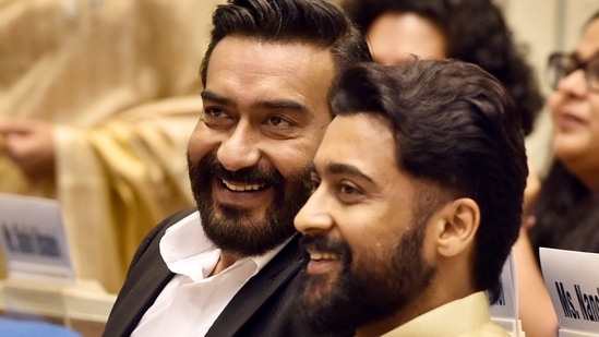 Ajay Devgn and Suriya at the 68th National Film Awards ceremony, at Vigyan Bhawan, in New Delhi. They both won the Best Actors trophy for Tanhaji and Soorarai Pottru.(Hindustan Times)