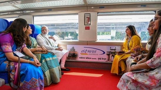 **EDS: HANDOUT PHOTO MADE AVAILABLE FROM PIB ON FRIDAY, SEPT. 30, 2022** Gandhinagar: Prime Minister Narendra Modi rides the Gandhinagar-Mumbai Vande Bharat Express train after flagging it off, in Gandhinagar, Friday, Sept. 30, 2022. (PTI Photo)(PTI09_30_2022_000105B)(PTI)