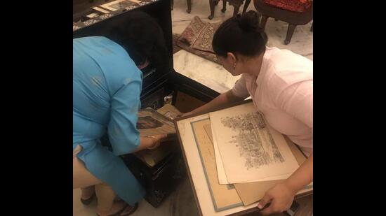 Entrepreneur Aditya Gupta’s family digging through a trunk of photographs at an old family home in Hyderabad. Past Perfect is helping him make a four-part series on his family.