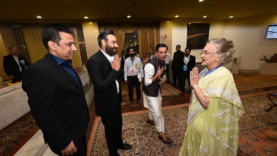 Ajay Devgn and Asha Parekh greet each other at the ceremony.