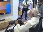 PM Modi test-driving a car in Europe sitting at Pragati Maidan through 5G technology on Saturday. PM Modi test-driving a car in Europe sitting at Pragati Maidan through 5G technology on Saturday.