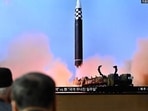 North Korea Ballistic Missile: People watch a television screen showing a news broadcast with file footage of a North Korean missile test. North Korea Ballistic Missile: People watch a television screen showing a news broadcast with file footage of a North Korean missile test.