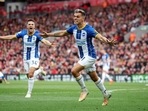 Leandro Trossard celebrates his hat-trick