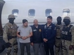 Efrain Antonio Campo Flores (2nd from L) and Franqui Fancisco Flores de Freitas stand with law enforcement officers in this November 12, 2015 photo after their arrest in Port Au Prince, Haiti. Efrain Antonio Campo Flores (2nd from L) and Franqui Fancisco Flores de Freitas stand with law enforcement officers in this November 12, 2015 photo after their arrest in Port Au Prince, Haiti. 