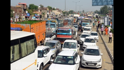 Commuters stuck in a long traffic jam during a demonstration by Punjab Roadways and PUNBUS employees over their various demands, at Pap Chowk, in Jalandhar on Saturday. (ANI photo)