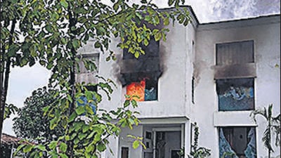 Pauri Garhwal: Smoke billows from a factory owned by Pulkit Arya after locals set it on fire, in Pauri Garhwal district, Saturday, Sept. 24, 2022. Police arrested Arya along with two employees of a resort owned by him in connection with its probe into the murder of a female resort receptionist, on Friday. (PTI Photo)(PTI09_24_2022_000111B) (PTI) Pauri Garhwal: Smoke billows from a factory owned by Pulkit Arya after locals set it on fire, in Pauri Garhwal district, Saturday, Sept. 24, 2022. Police arrested Arya along with two employees of a resort owned by him in connection with its probe into the murder of a female resort receptionist, on Friday. (PTI Photo)(PTI09_24_2022_000111B) (PTI)