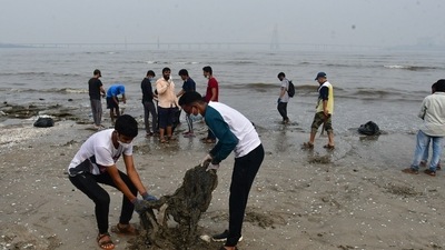 College Student , NGO, along with Municipal Corporation of Greater Mumbai (BMC) organized Mumbai's Beach-Cleaning Drive post-Ganpati-Visarjan on the Dadar Mumbai's beach September 11. (PTI)