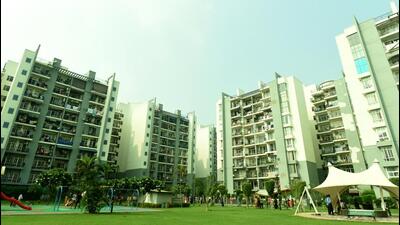 when the authority team reached the complex on Friday morning, they found that a group of residents had locked the front gates and were staging a protest inside. (Sunil Ghosh/HT Photo) when the authority team reached the complex on Friday morning, they found that a group of residents had locked the front gates and were staging a protest inside. (Sunil Ghosh/HT Photo)