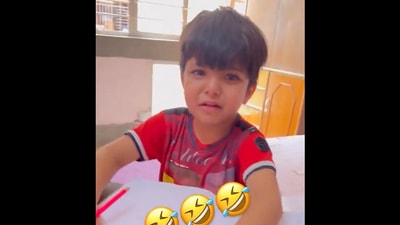 The toddler was crying while completing his homework (Twitter/@Gulzar_sahab) The toddler was crying while completing his homework (Twitter/@Gulzar_sahab)