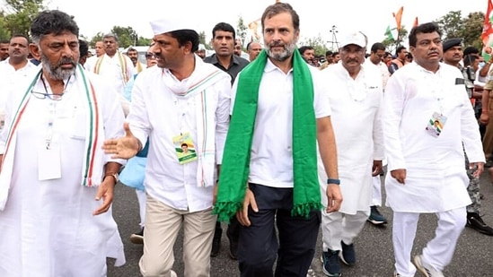 Chamarajanagar, Oct 01 (ANI): Congress leader Rahul Gandhi with Karnataka Congress President D K Shivakumar walks during his party's Bharat Jodo Yatra from Tondavadi Gate at Gundlupet, in Chamarajanagar on Saturday. (ANI Photo)(Congress Twitter)