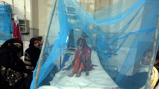 A Pakistani patient suffering from dengue fever, a mosquito-borne disease, is treated in an isolation ward, at a hospital in Karachi.(AP) A Pakistani patient suffering from dengue fever, a mosquito-borne disease, is treated in an isolation ward, at a hospital in Karachi.(AP)