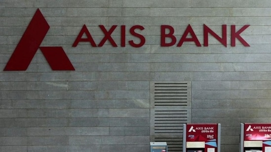 Axis Bank's logo is seen next to ATM machines at its corporate headquarters in Mumbai. Axis Bank's logo is seen next to ATM machines at its corporate headquarters in Mumbai.