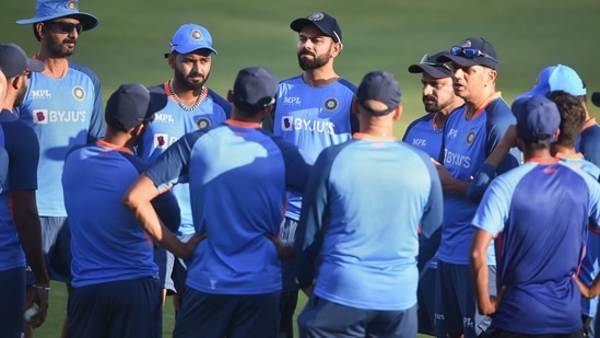 Indian captain Rohit Sharma with head coach Rahul Dravid and other teammates during a practice session(PTI)