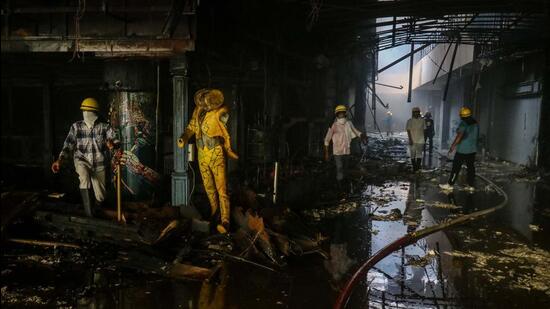 Gurugram, India - Oct. 1, 2022: Fire fighters douse the fire at Global Foyer Mall on Golf Course Road, in Gurugram, India, on Saturday, October 1, 2022. (Photo by Vipin Kumar/ Hindustan Times) (Hindustan Times) Gurugram, India - Oct. 1, 2022: Fire fighters douse the fire at Global Foyer Mall on Golf Course Road, in Gurugram, India, on Saturday, October 1, 2022. (Photo by Vipin Kumar/ Hindustan Times) (Hindustan Times)