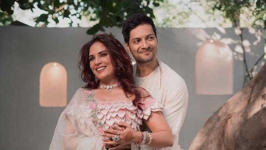 Richa Chadha and Ali Fazal were all smiles as the photographers captured the couple in their designer wedding fits.(Instagram/@therichachadha)