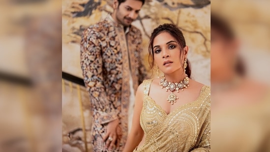 Richa Chadha draped a stunning embellished golden saree while Ali Fazal complimented his wife-to-be in his embroidered sherwani.(Instagram/@therichachadha)
