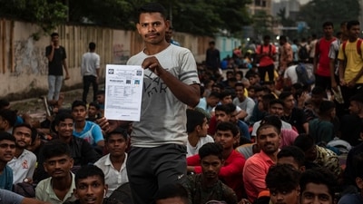Gorakh Bhosale, 19, &nbsp;from Lasal village in Nashik district shows his application form outside the Mumbra camp in Thane, on September 29. After completion of the four- year- tenure, 25% of the Agniveers will be absorbed as regular cadre of the Indian armed forces based on the organizational requirement. (Satish Bate / HT Photo)