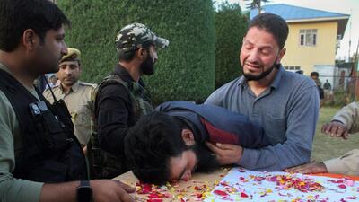 Relatives mourn near the mortal remains of slain policeman Javid Ahmad Dar after militants attacked a security forces team in Pulwama district on Sunday. A policeman was killed and a CRPF personnel injured in the attack. (PTI) Relatives mourn near the mortal remains of slain policeman Javid Ahmad Dar after militants attacked a security forces team in Pulwama district on Sunday. A policeman was killed and a CRPF personnel injured in the attack. (PTI)