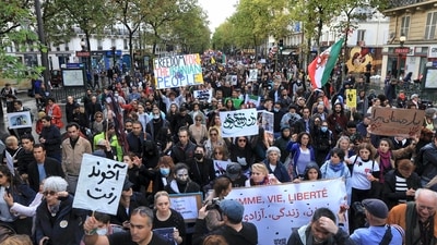 Iran Anti-Hijab Protests: Protesters march a demonstration to show support for Iranian protesters standing up to their leadership over the death of a young woman in police custody in Paris. (AP)