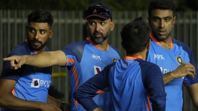 Indian cricketer Mohammed Siraj, left, Ravichandran Ashwin, right, and Yuzvendra Chahal, front discuss during a training session. (AP) Indian cricketer Mohammed Siraj, left, Ravichandran Ashwin, right, and Yuzvendra Chahal, front discuss during a training session. (AP)