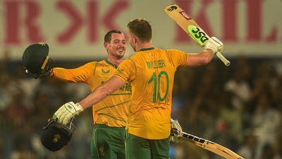 South African batter David Miller celebrates after scoring a century with teammate Quinton de Kock during the 2nd T20I between India and South Africa (PTI) South African batter David Miller celebrates after scoring a century with teammate Quinton de Kock during the 2nd T20I between India and South Africa (PTI)