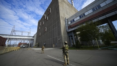 Russia-Ukraine War: Russian servicemen guard an area of the Zaporizhzhia Nuclear Power Station, the largest nuclear power plant in Europe. (AP) Russia-Ukraine War: Russian servicemen guard an area of the Zaporizhzhia Nuclear Power Station, the largest nuclear power plant in Europe. (AP)