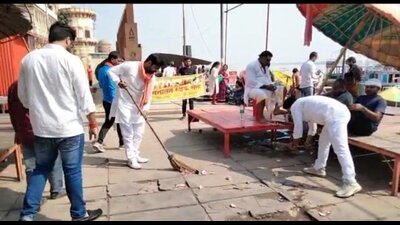 Activists cleaning Assi Ghat in Varanasi on Sunday. (HT PHOTO)