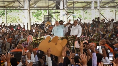 Prime Minister Narendra Modi waves at supporters during a roadshow, in Surat, Thursday, Sept. 29, 2022. (PTI) Prime Minister Narendra Modi waves at supporters during a roadshow, in Surat, Thursday, Sept. 29, 2022. (PTI)