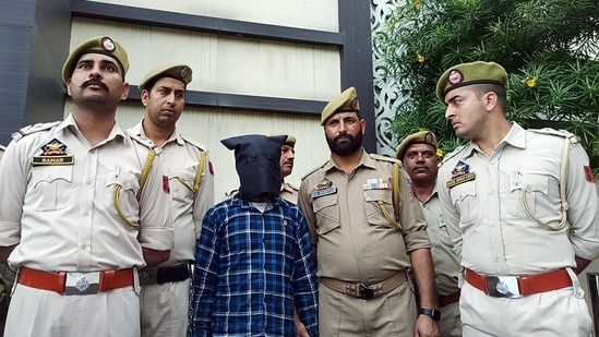 An accused of the Udhampur twin bus blasts case being produced during a press conference held by Jammu and Kashmir DGP Dilbagh Singh, in Jammu on Sunday.&nbsp;(ANI)